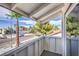 Inviting balcony showcasing scenic neighborhood views with palm trees and single story homes under a bright, sunny sky at 2611 Siesta Ave, Las Vegas, NV 89121