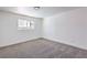 Bedroom featuring neutral colored walls and carpet with a view from the window at 2611 Siesta Ave, Las Vegas, NV 89121
