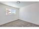 A bedroom featuring neutral colored walls and carpet with a view from the window at 2611 Siesta Ave, Las Vegas, NV 89121