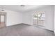 Bright bedroom with neutral carpet and sliding glass doors to the balcony at 2611 Siesta Ave, Las Vegas, NV 89121