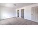 Spacious bedroom featuring plush carpeting, neutral walls, and ensuite bath and closet at 2611 Siesta Ave, Las Vegas, NV 89121