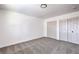 A bedroom with neutral colored walls and carpet, and two large closets at 2611 Siesta Ave, Las Vegas, NV 89121