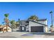 Charming two-story home featuring updated finishes and a black garage door at 2611 Siesta Ave, Las Vegas, NV 89121