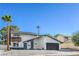 Charming two-story home featuring updated finishes and a black garage door at 2611 Siesta Ave, Las Vegas, NV 89121
