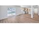Spacious living area adjacent to the kitchen, with wood-look floors and access to pool area at 2611 Siesta Ave, Las Vegas, NV 89121