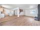 Bright living room featuring new floors, fireplace, and access to the kitchen and stairs at 2611 Siesta Ave, Las Vegas, NV 89121