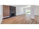 Bright living room features modern fireplace, wood-look floors, and natural light, perfect for entertaining at 2611 Siesta Ave, Las Vegas, NV 89121