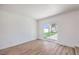 Bright, airy room with wood-look floors and sliding glass door access to the outdoors at 2611 Siesta Ave, Las Vegas, NV 89121