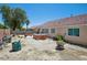 Backyard featuring a wooden hot tub and potential for landscaping with space for customization at 2716 Orchid Moon Ct, North Las Vegas, NV 89031