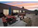 Backyard oasis featuring a wooden hot tub, picnic table, and built-in grill for outdoor entertaining at 2716 Orchid Moon Ct, North Las Vegas, NV 89031