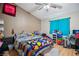 This bedroom features a vaulted ceiling, wood flooring, and a blue curtain at 2716 Orchid Moon Ct, North Las Vegas, NV 89031