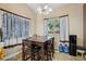 Inviting dining area featuring a table with seating, a window, and tile flooring at 2716 Orchid Moon Ct, North Las Vegas, NV 89031