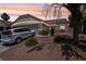 Charming single-story home featuring a tile roof, desert landscaping, and a two-car garage at 2716 Orchid Moon Ct, North Las Vegas, NV 89031