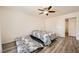 Bright bedroom featuring wood-look flooring and a ceiling fan for added comfort at 2838 Geary Pl # 4017, Las Vegas, NV 89109