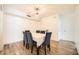 Well-lit dining room with wood floors, a chandelier, and seating for six at 2838 Geary Pl # 4017, Las Vegas, NV 89109