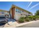 Two-story condo with brick accents, multiple windows, and a well-maintained landscaped yard at 2838 Geary Pl # 4017, Las Vegas, NV 89109