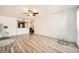 Bright living room with light wood flooring and modern decor, connected to the kitchen at 2838 Geary Pl # 4017, Las Vegas, NV 89109