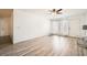 Spacious living area with wood floors, bright windows, and a door leading to the outside at 2838 Geary Pl # 4017, Las Vegas, NV 89109