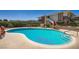 Large community pool surrounded by lounge chairs and shaded seating areas at 2838 Geary Pl # 4017, Las Vegas, NV 89109