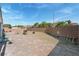 Expansive backyard with brick patio, rock landscaping, and privacy wall at 3108 Sentimental Ct, North Las Vegas, NV 89031