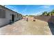 Spacious backyard with brick pavers, gravel, and privacy wall at 3108 Sentimental Ct, North Las Vegas, NV 89031