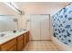 Bathroom featuring dual sinks, a large mirror, and a shower/tub combo at 3108 Sentimental Ct, North Las Vegas, NV 89031