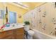 A well-maintained bathroom with a tub and shower combo, a single sink vanity and neutral finishes at 3108 Sentimental Ct, North Las Vegas, NV 89031