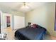 Well-lit bedroom features a ceiling fan and neutral wall color at 3108 Sentimental Ct, North Las Vegas, NV 89031