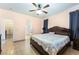 Bedroom with a bed and arched doorway to another bedroom and bathroom at 3108 Sentimental Ct, North Las Vegas, NV 89031