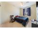 Cozy bedroom featuring tiled flooring, a window, and a ceiling fan at 3108 Sentimental Ct, North Las Vegas, NV 89031