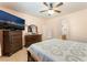 Bedroom with natural light, fan, and television on dresser and mirror at 3108 Sentimental Ct, North Las Vegas, NV 89031