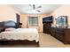 Bedroom with natural light, fan, and television on dresser at 3108 Sentimental Ct, North Las Vegas, NV 89031