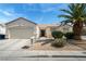 Inviting single-story home with desert landscaping and an attached garage at 3108 Sentimental Ct, North Las Vegas, NV 89031