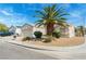 Charming single-story home featuring a desert-landscaped front yard and a palm tree at 3108 Sentimental Ct, North Las Vegas, NV 89031