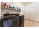 A well-equipped laundry room with sleek, modern appliances for efficient laundry care at 3108 Sentimental Ct, North Las Vegas, NV 89031