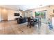 Open concept living and dining area featuring tile floors and plenty of space for entertaining at 3108 Sentimental Ct, North Las Vegas, NV 89031
