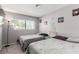 Bedroom with twin beds, window, and decorative pictures on the wall at 3158 Brockington Dr, Las Vegas, NV 89120