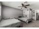 Neutral bedroom featuring two twin beds, a ceiling fan, and hexagon wall décor at 3158 Brockington Dr, Las Vegas, NV 89120