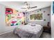 Neutral bedroom with flower wall stickers, ceiling fan, and a gray bed set at 3158 Brockington Dr, Las Vegas, NV 89120