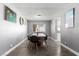 This dining room is very spacious with an expansive window at 3158 Brockington Dr, Las Vegas, NV 89120