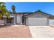 Charming home with a well-maintained exterior, featuring a double-door entry and two-car garage at 3158 Brockington Dr, Las Vegas, NV 89120