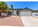 Charming single-Gathering home featuring a well-maintained front yard and an attached two-car garage at 3158 Brockington Dr, Las Vegas, NV 89120