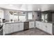 Well-lit kitchen featuring granite countertops, stainless steel appliances, and ample cabinet space at 3158 Brockington Dr, Las Vegas, NV 89120