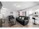 Inviting living area with a comfortable sofa, bar access, and an open layout at 3158 Brockington Dr, Las Vegas, NV 89120