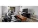 Cozy living area features a modern sofa and decorative elements under a large window at 3158 Brockington Dr, Las Vegas, NV 89120