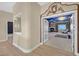 A peek into the bedroom with a unique ceiling, fireplace, and comfortable seating area at 3372 Westwind Rd, Las Vegas, NV 89146