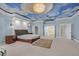 Spacious bedroom with custom ceiling design, carpet floors, and ample closet space at 3372 Westwind Rd, Las Vegas, NV 89146