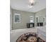 Bedroom with ample lighting, dark wood desks, and an area rug at 3372 Westwind Rd, Las Vegas, NV 89146