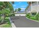 Spacious driveway leads to a three-car garage with solar panels on the roof at 3372 Westwind Rd, Las Vegas, NV 89146