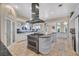 Spacious kitchen featuring a center island, professional appliances, and a sleek range hood at 3372 Westwind Rd, Las Vegas, NV 89146